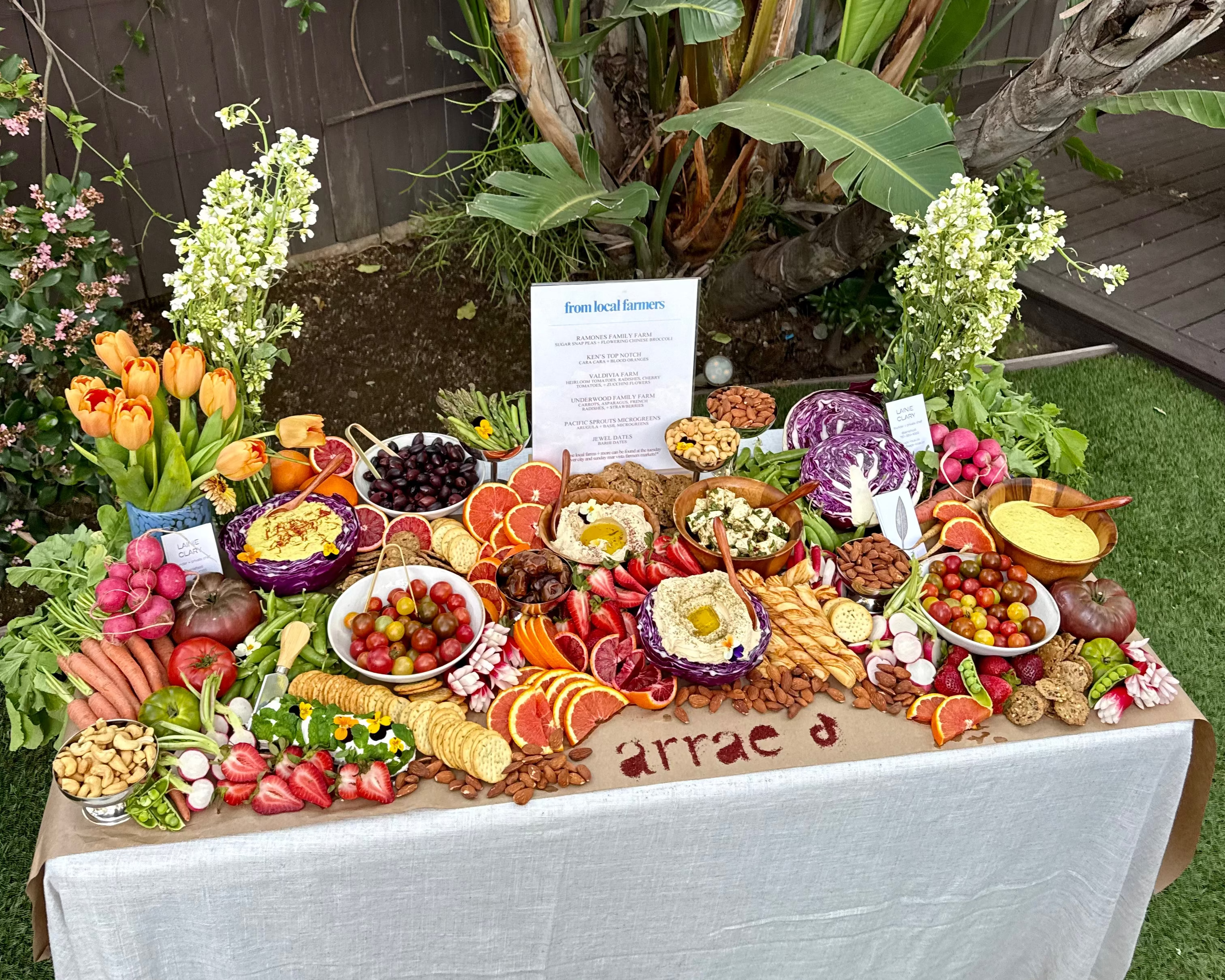 Seasonal produce and dishes arranged across a long farm table